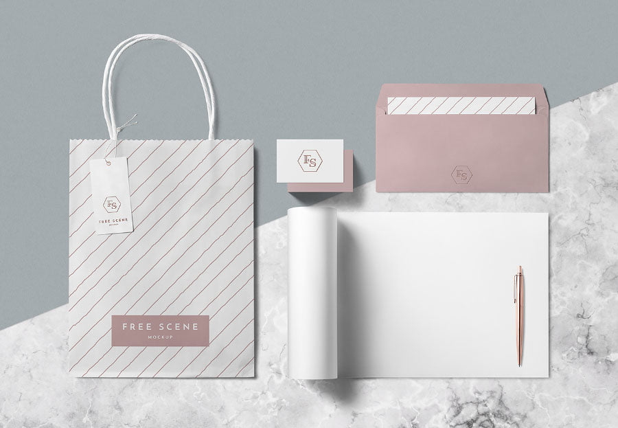 Free PSD Stationery Scene Mockup with Paper Bag and Pen