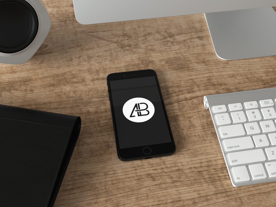 Free Realistic Jet Black iPhone 7 Plus Mockup Office Scene