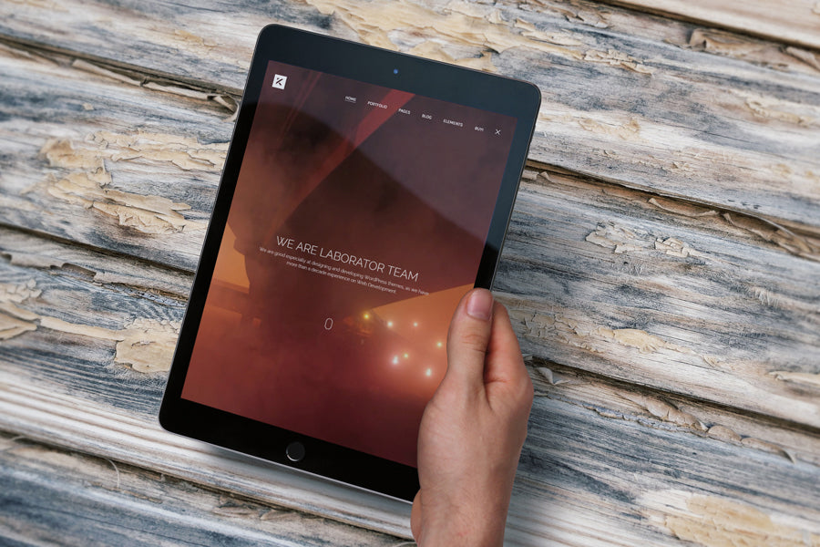 Free iPad Air in the Hand PSD Mockup