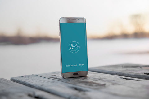 Free Android Smart Phone Mockup on a Wooden Table Outdoors