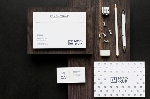 Free Arrangement Of Mock-Up Stationery On Wood Psd