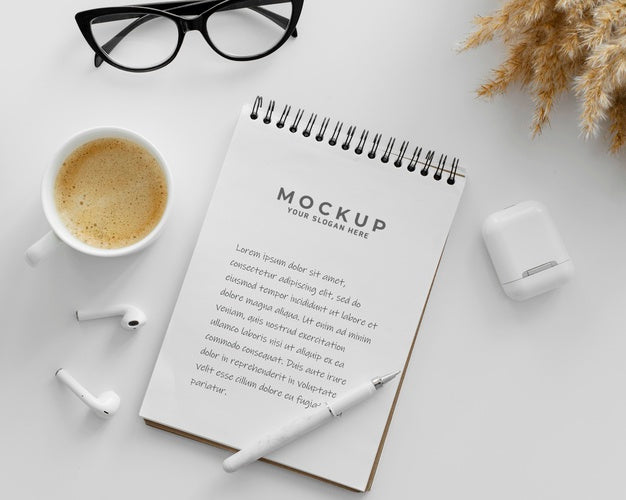 Free Arrangement With Mock-Up Notepad On A Desk Psd