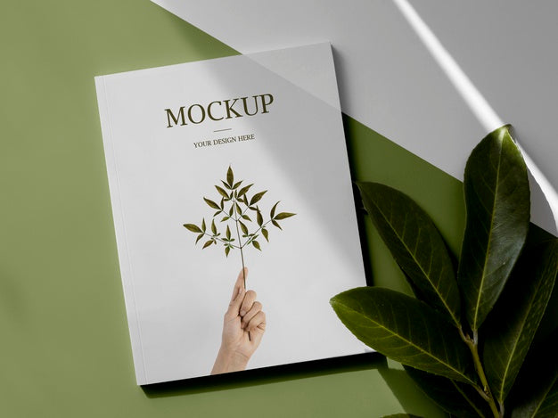 Free Assortment With Magazine And Leaves Above View Psd