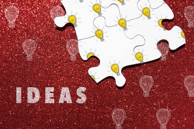 Free Assortment With Puzzle Pieces On Red Background Psd