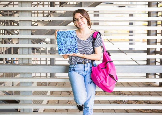 Free Back To School Concept With Girl Presenting Book Cover Psd