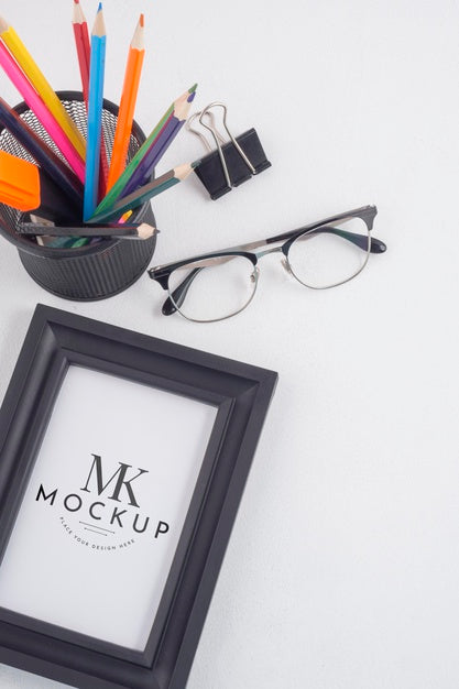 Free Black Frame Mock-Up Next To Stationery Elements Arrangement Psd