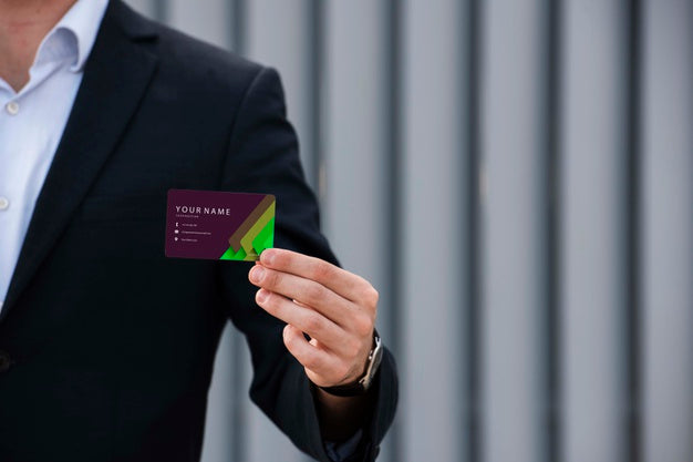 Free Businessman Holding Company Business Card Psd