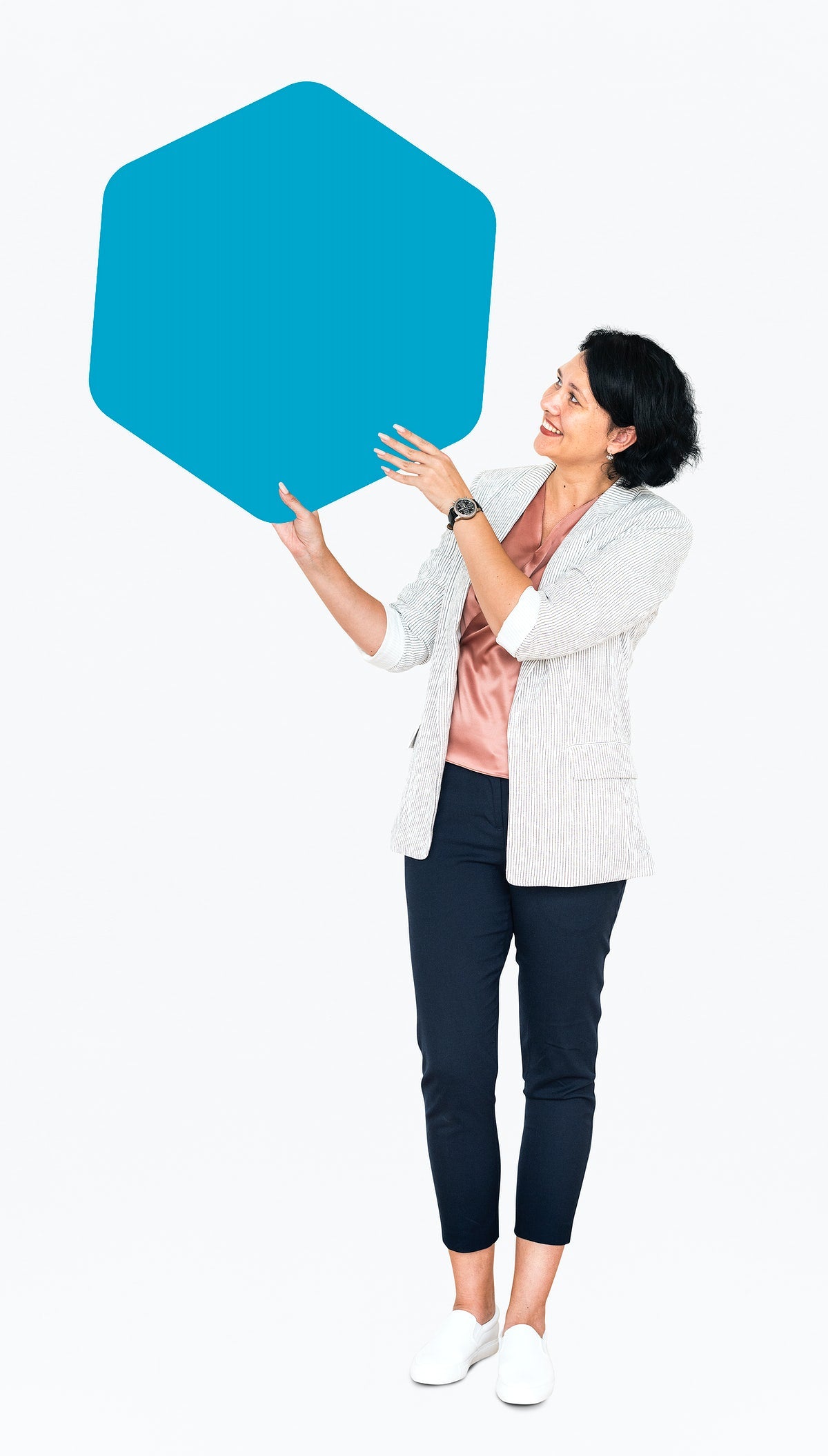 Free Cheerful Woman Showing A Blank Blue Hexagon Shaped Board