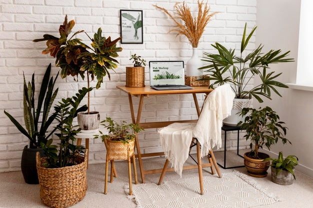 Free Close Up On Computer Mockup Surrounded By Plants Psd