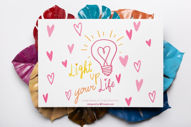 Free Colorful Painted Leaves With Paper On Top Psd