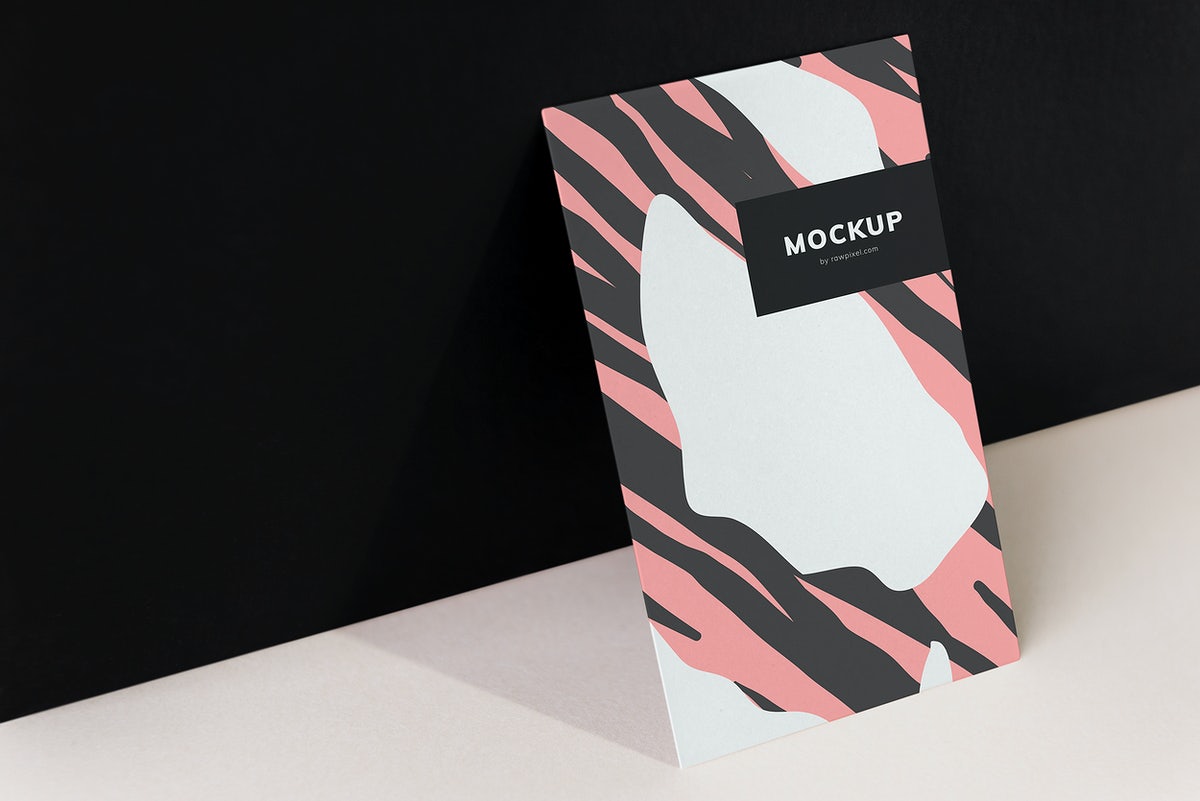 Free Colorful Paperboard Mockup Against The Black Wall