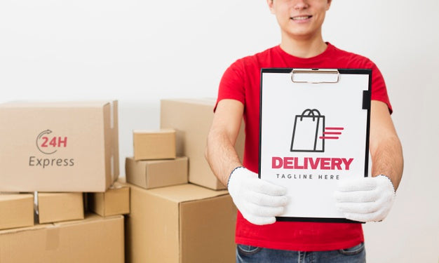 Free Courier Holding Clipboard In Front Of Parcels Mock-Up Psd