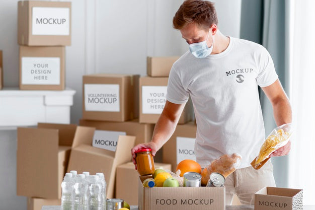 Free Front View Of Male Volunteer With Medical Mask Preparing Food Donation Box Psd