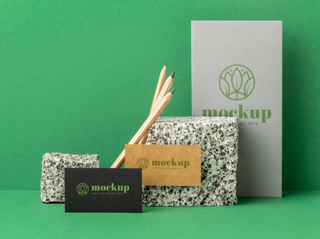 Free Front View Of Paper Stationery With Rocks Psd