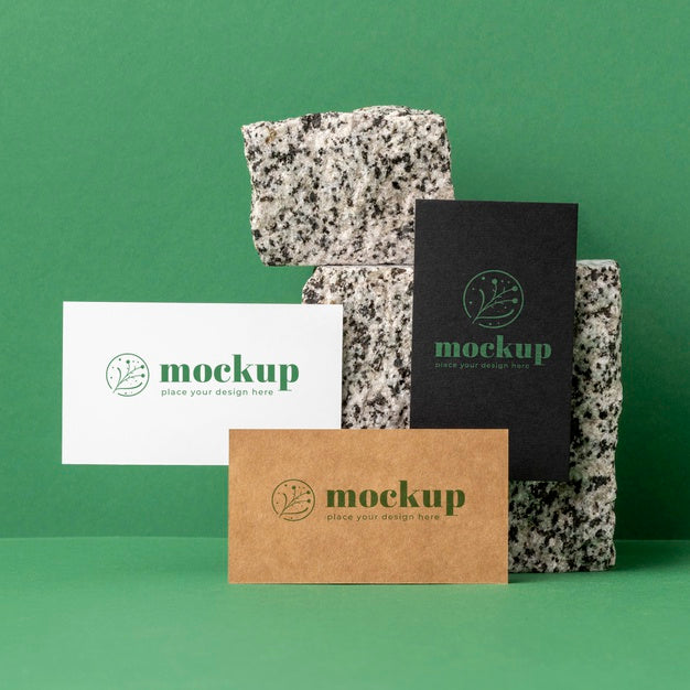 Free Front View Of Paper Stationery With Stones Psd