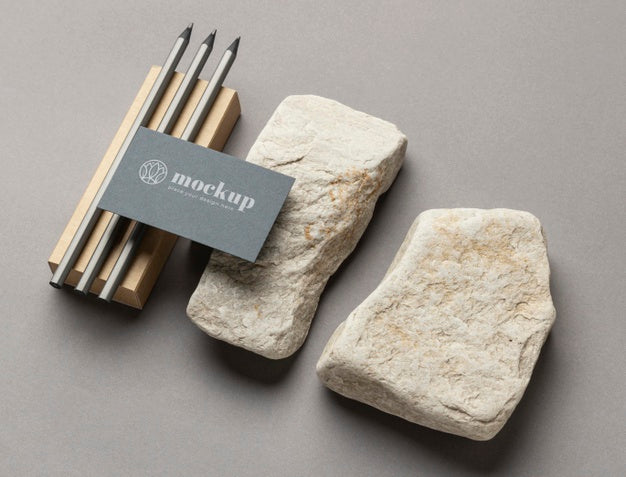 Free High Angle Of Paper Stationery With Stones And Pencils Psd