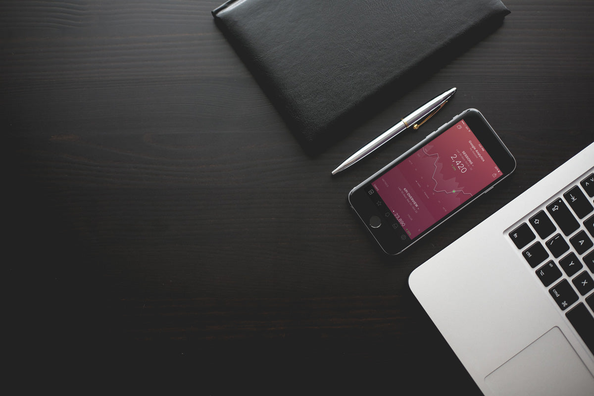 Free iPhone 7 Mockup on a Black Table