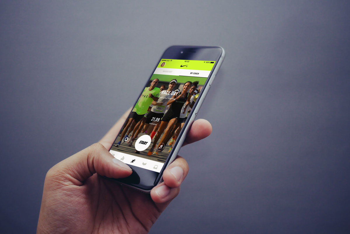 Free iPhone Mockup in Mans Hand with Gray Background