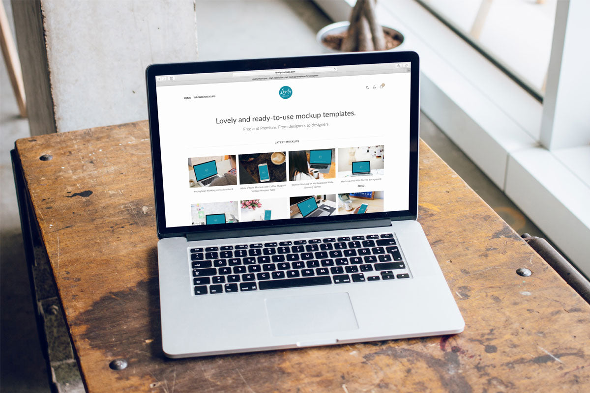 Free Macbook Pro 15" On Carpenter Desk Mockup