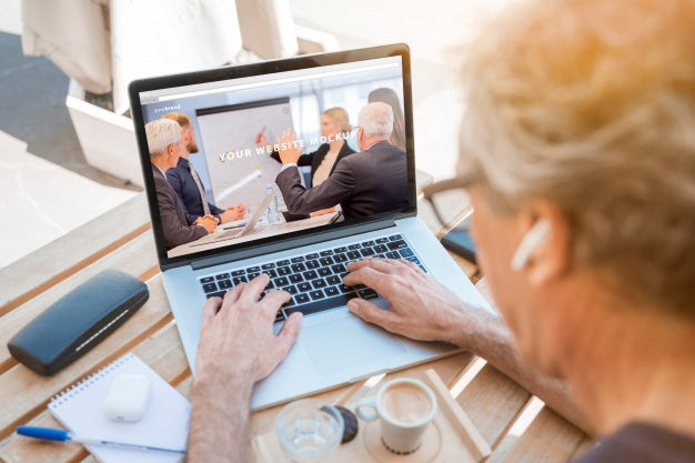 Free Man Looking At Laptop Mockup Psd