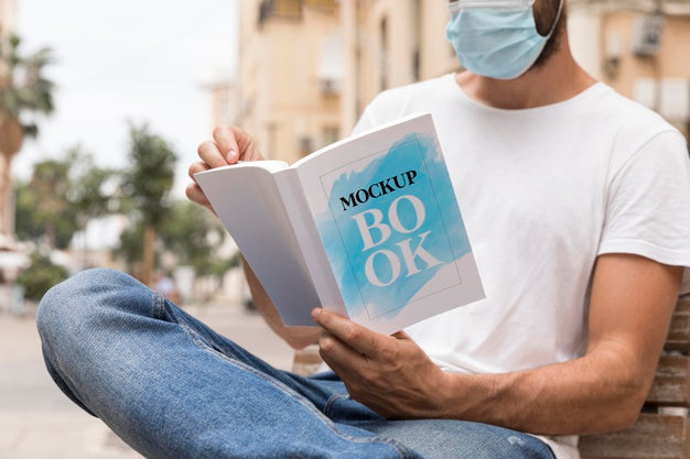 Free Man With Mask On Street Reading Book Psd