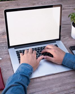 Free Mockup: Male Lancer Working On Macbook