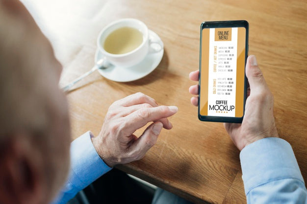 Free Over The Shoulder Adult In A Coffee Shop Mock-Up Psd