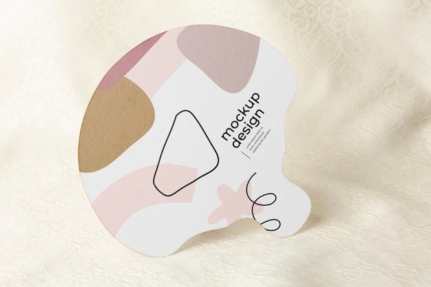 Free Paper Mock-Up Hand Fan On Textile Psd