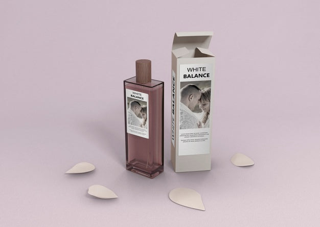 Free Perfume Container On Table With Petals Psd