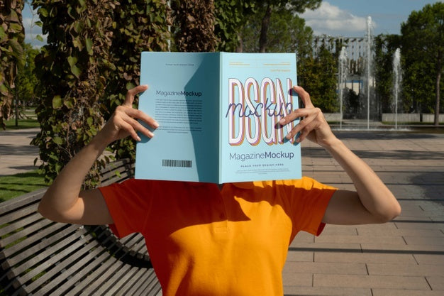 Free Person Reading Color Pop Magazine With Cover Mockup Psd