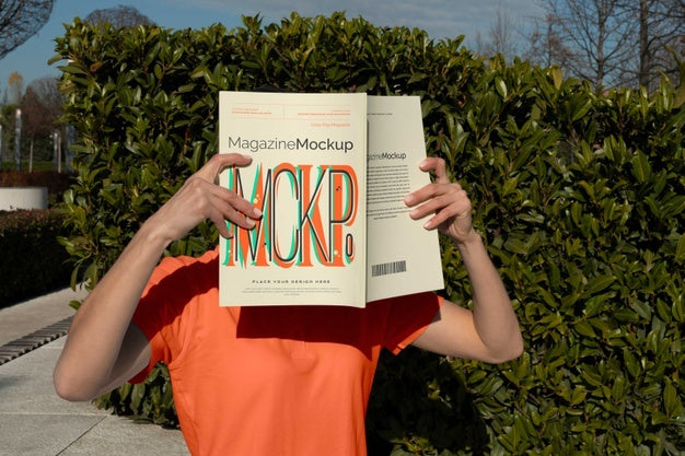 Free Person Reading Color Pop Magazine With Cover Mockup Psd