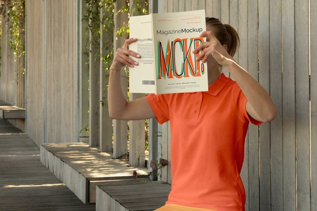 Free Person Reading Color Pop Magazine With Cover Mockup Psd