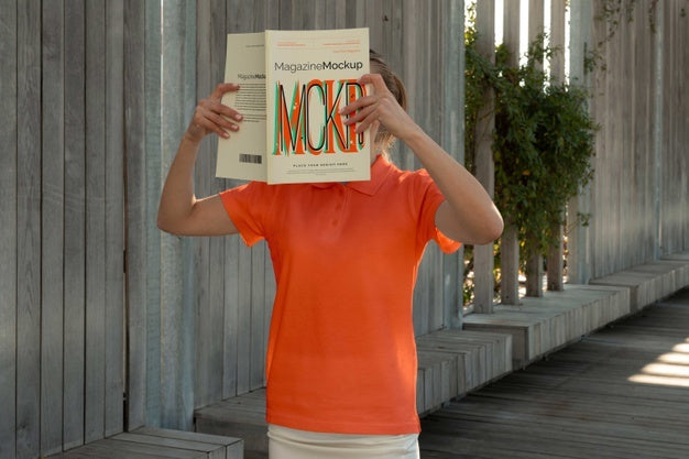 Free Person Reading Color Pop Magazine With Cover Mockup Psd