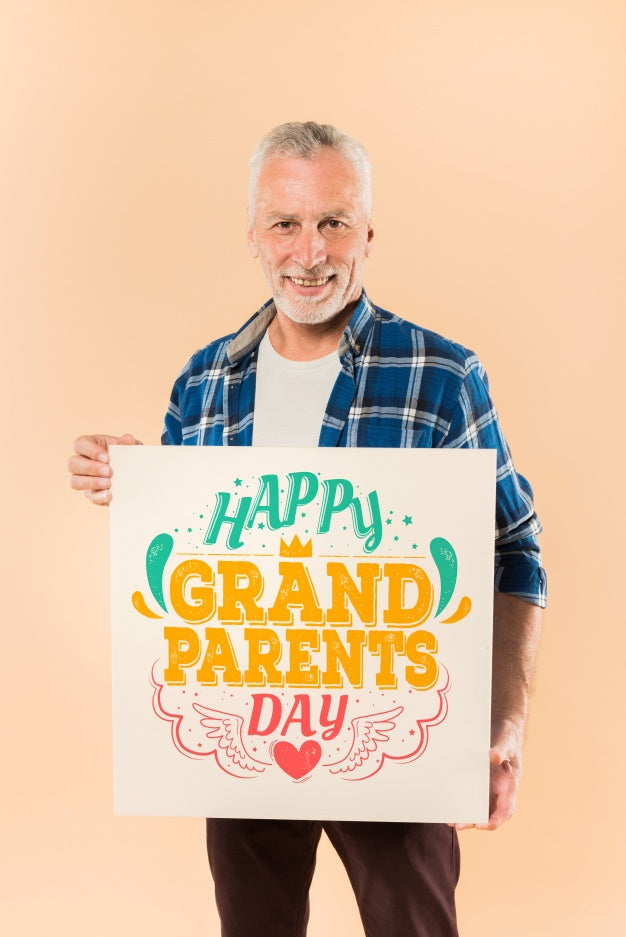 Free Senior Man Presenting Board For Grandparents Day Psd