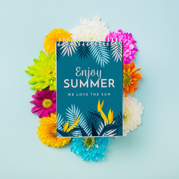 Free Spiral Notepad Mockup On Colorful Flowers Psd