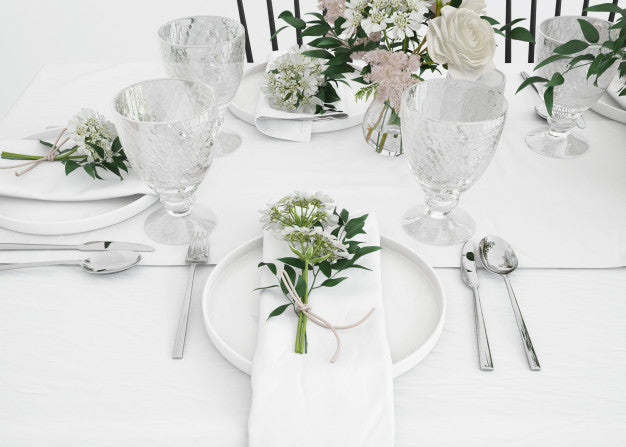 Free Table Prepared To Eat With Cutlery And Decorative Flowers Psd