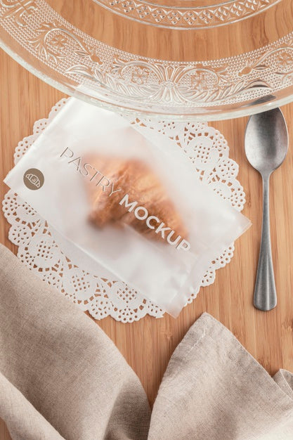 Free Top View Croissant In Transparent Packaging Psd