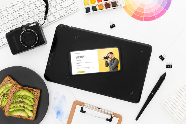 Free Top View Desk With Phone Mock-Up And Avocado Toast Psd