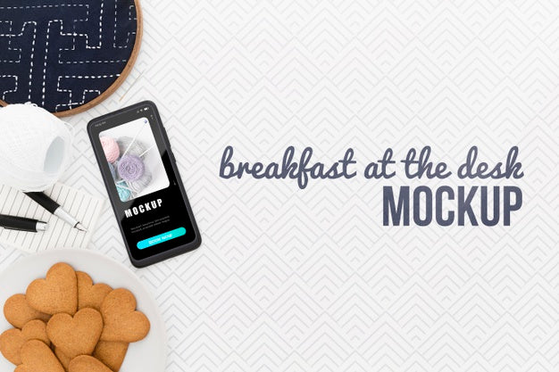 Free Top View Desk With Phone Mock-Up And Cookies Psd