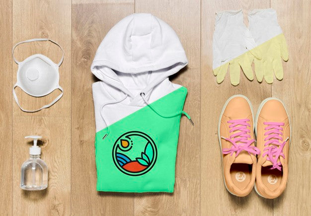 Free Top View Folded Hoodie Mock-Up With Shoes Mask And Gloves Psd