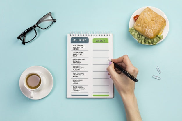 Free Top View Notebook With Daily Tasks And Coffee Psd