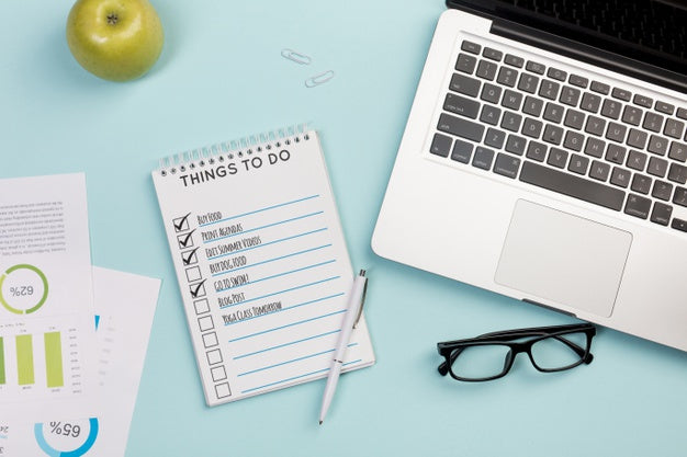 Free Top View Notebook With Daily Tasks And Laptop Psd