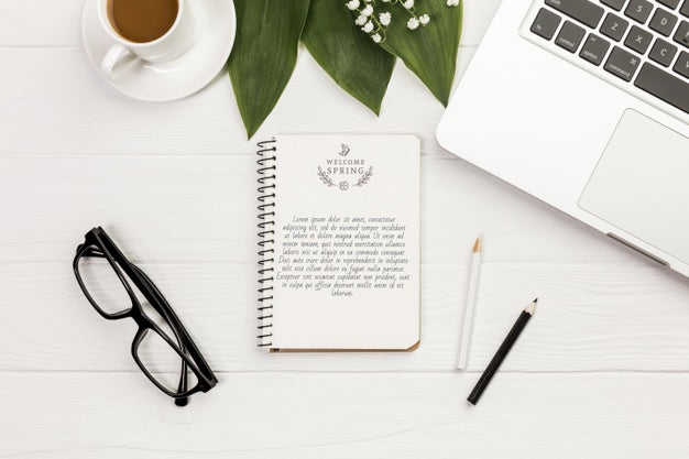 Free Top View Notebook With Eyeglasses And Laptop Psd
