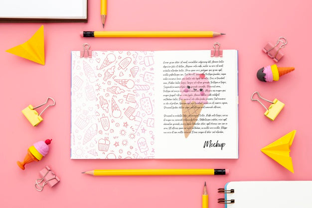 Free Top View Of Desk Surface With Notebook And Paper Clips Psd