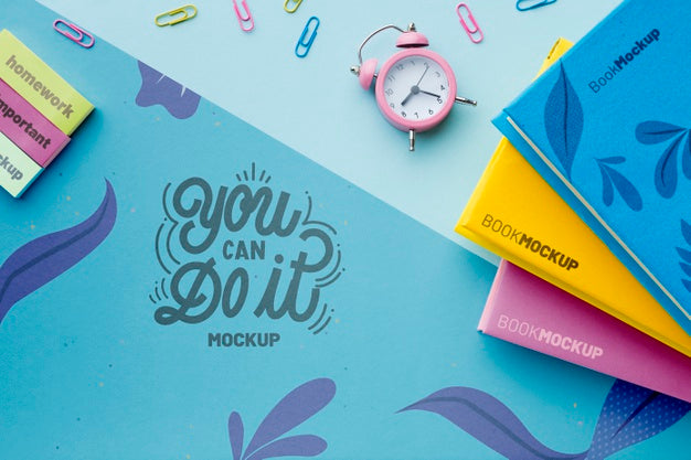 Free Top View Of Desk With Clock And Notebooks Psd