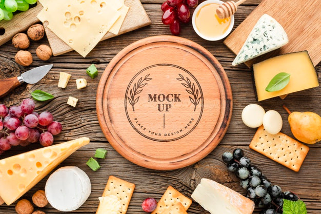 Free Top View Of Mock-Up Assortment Of Locally Grown Cheese With Grapes Psd