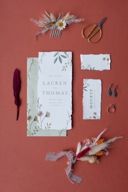 Free Top View Of Mock-Up Rustic Paper Wedding Invitation With Leaves And Flowers Psd