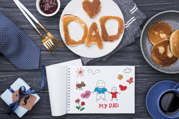 Free Top View Of Pancakes For Fathers Day With Notepad And Gift Psd