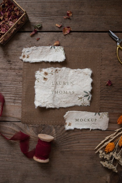 Free Top View Of Paper Mock-Up Rustic Wedding Invitation With Leaves And Flowers Psd