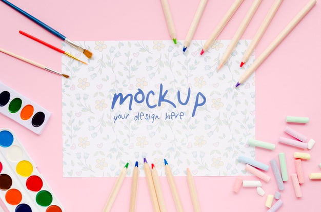 Free Top View Of Paper With Pencils And Brushes Psd
